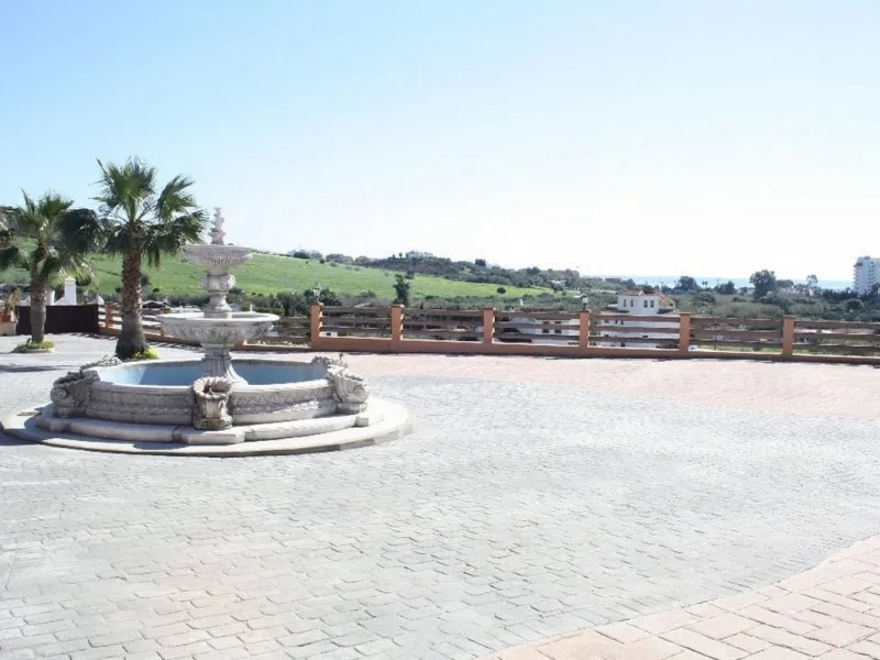 Private Estate of 4,250 m²** with a swimming pool, covered parking, sea-view lookout, barbecue oven, and terrace with views. The house spans 650 m² over three floors: equipped kitchen, living room, dining room for 10, study, suite with bathroom, 4 double 