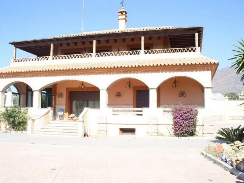 Private Estate of 4,250 m²** with a swimming pool, covered parking, sea-view lookout, barbecue oven, and terrace with views. The house spans 650 m² over three floors: equipped kitchen, living room, dining room for 10, study, suite with bathroom, 4 double 
