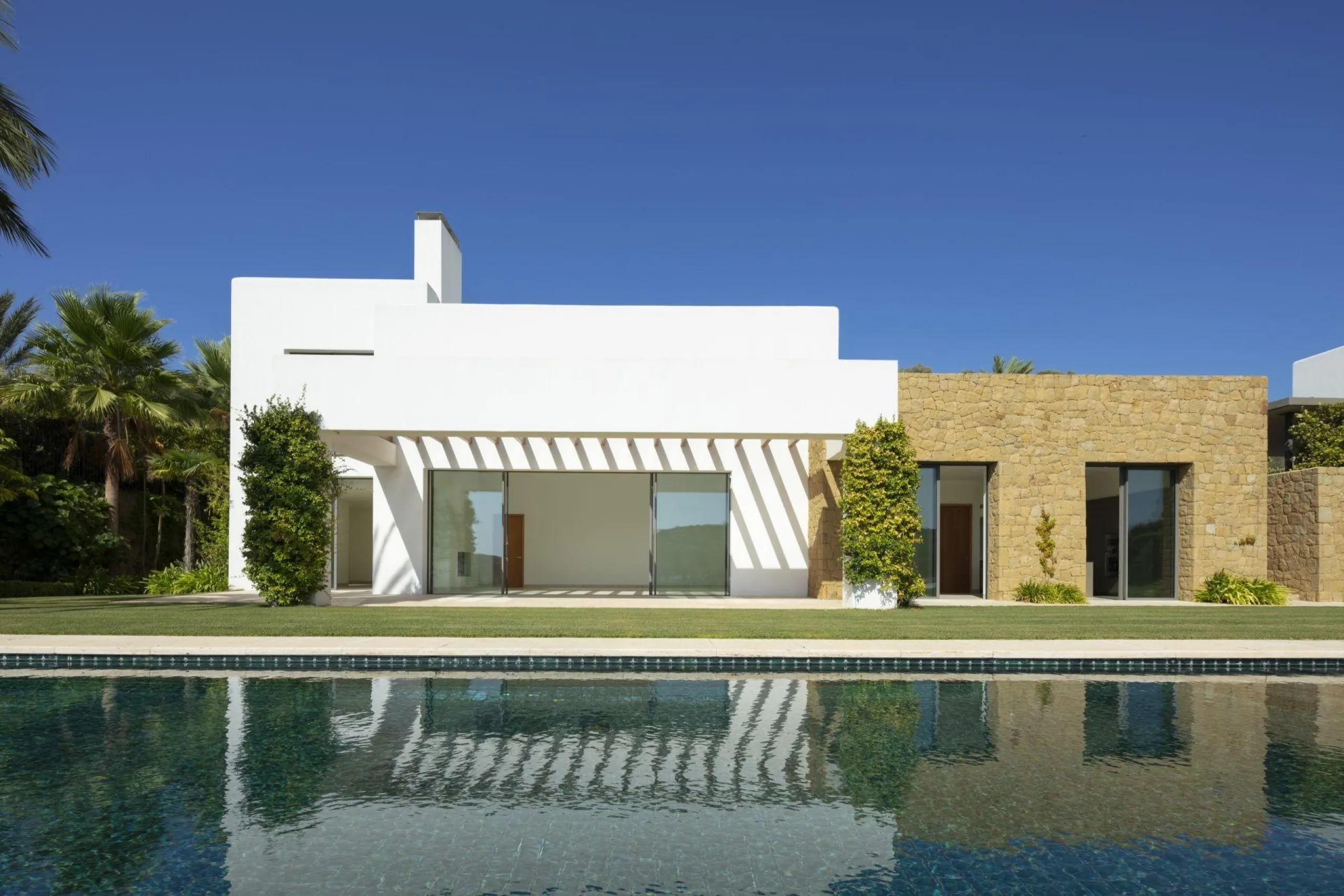 NEW BUILD EXCLUSIVE LUXURY VILLA AT FINCA CORTESÍN, CASARES& & Nestled within the enclave in the Finca Cortesin resort, this New Build villa exudes the charm of Ibiza-style residences. & The white structure, adorned with traditional Mediterranean