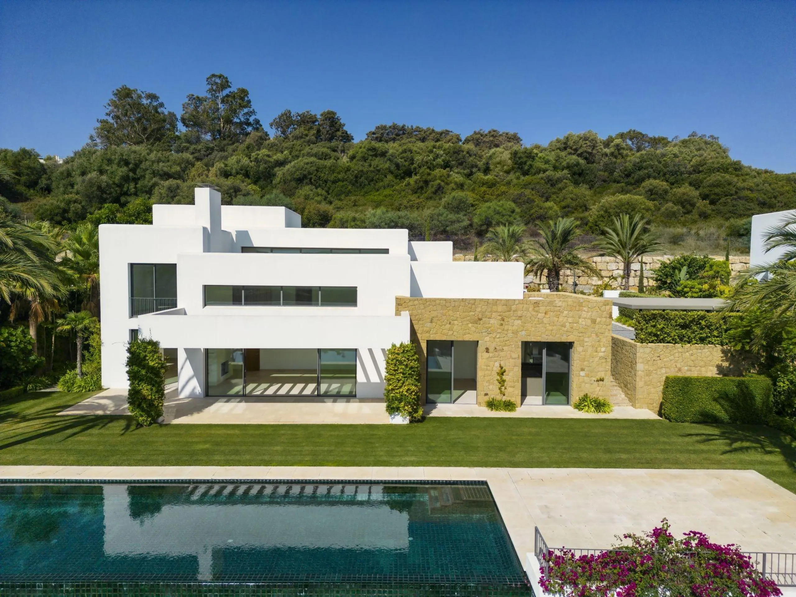 NEW BUILD EXCLUSIVE LUXURY VILLA AT FINCA CORTESÍN, CASARES& & Nestled within the enclave in the Finca Cortesin resort, this New Build villa exudes the charm of Ibiza-style residences. & The white structure, adorned with traditional Mediterranean