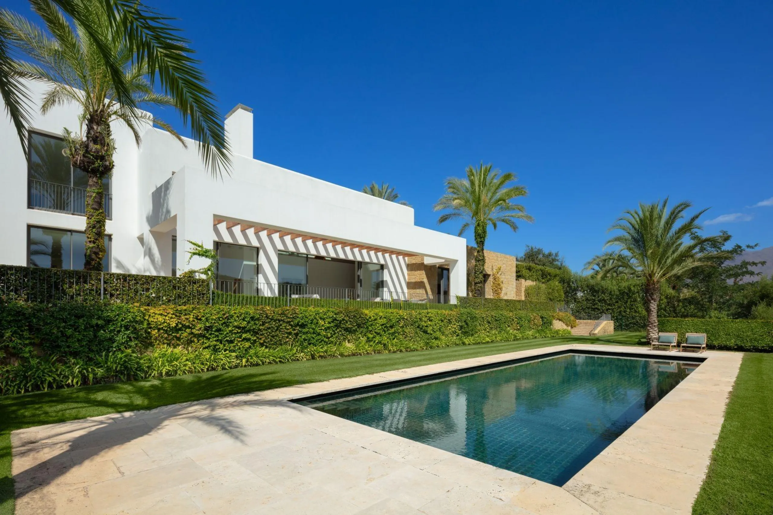 NEW BUILD EXCLUSIVE LUXURY VILLA AT FINCA CORTESÍN, CASARES& & Nestled within the enclave in the Finca Cortesin resort, this New Build villa exudes the charm of Ibiza-style residences. & The white structure, adorned with traditional Mediterranean