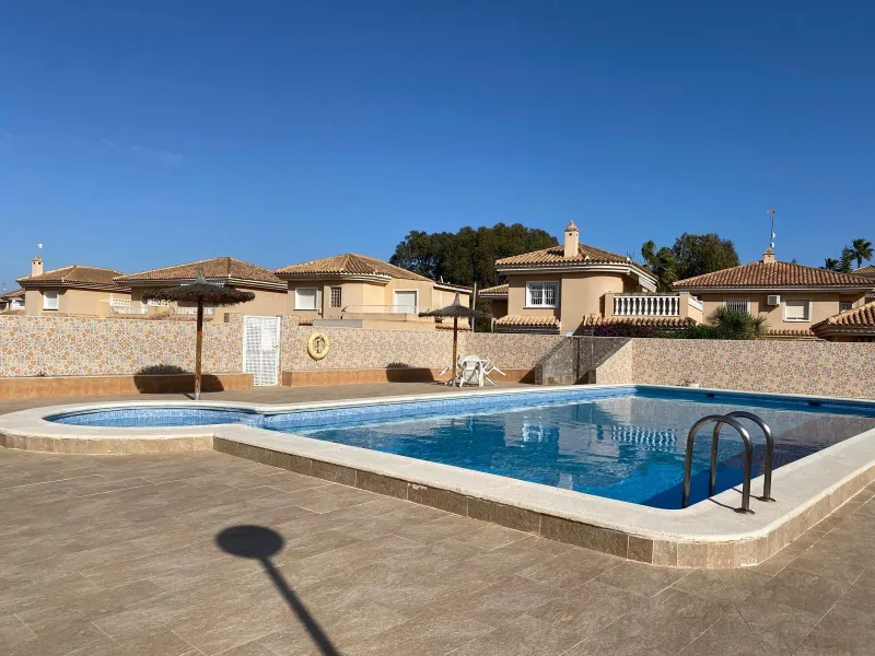 House with large plot, parking, and communal pool
