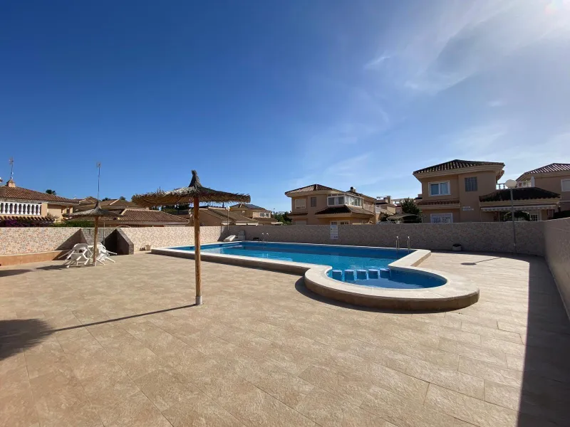 House with large plot, parking, and communal pool