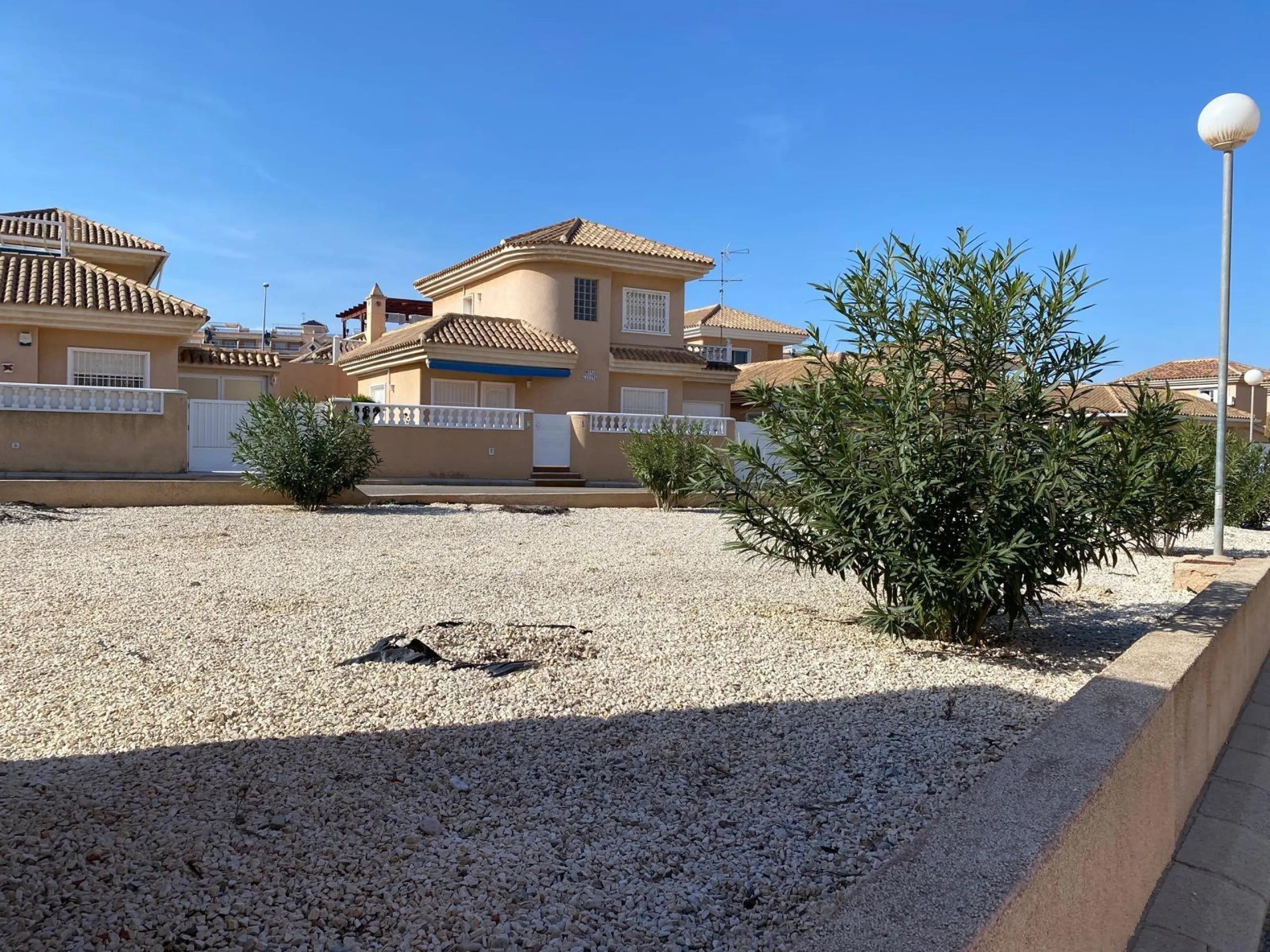 House with large plot, parking, and communal pool