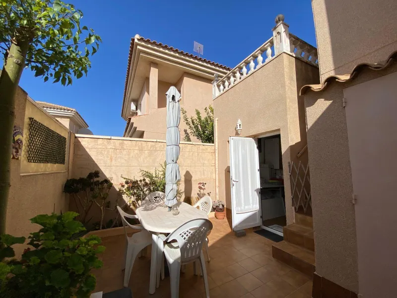 House with large plot, parking, and communal pool