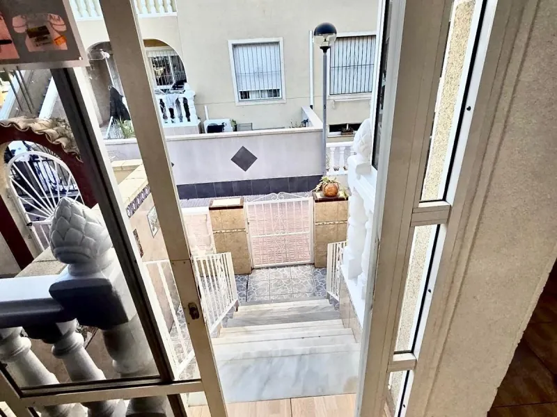 Townhouse with private garage, solarium and pool in Laguna, Orihuela Costa – excellent potential