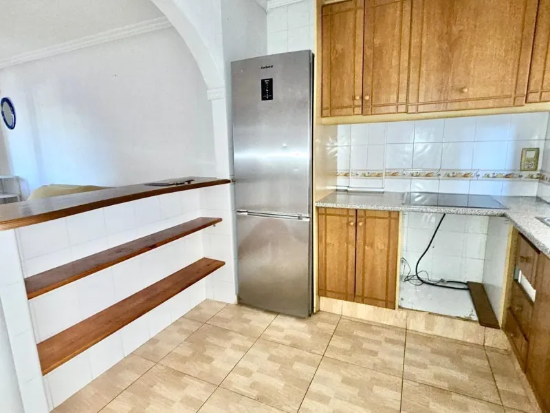 Townhouse with private garage, solarium and pool in Laguna, Orihuela Costa – excellent potential