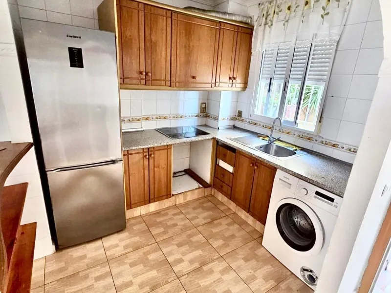 Townhouse with private garage, solarium and pool in Laguna, Orihuela Costa – excellent potential