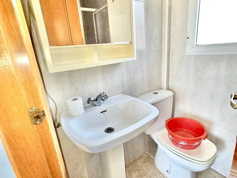 Townhouse with private garage, solarium and pool in Laguna, Orihuela Costa – excellent potential
