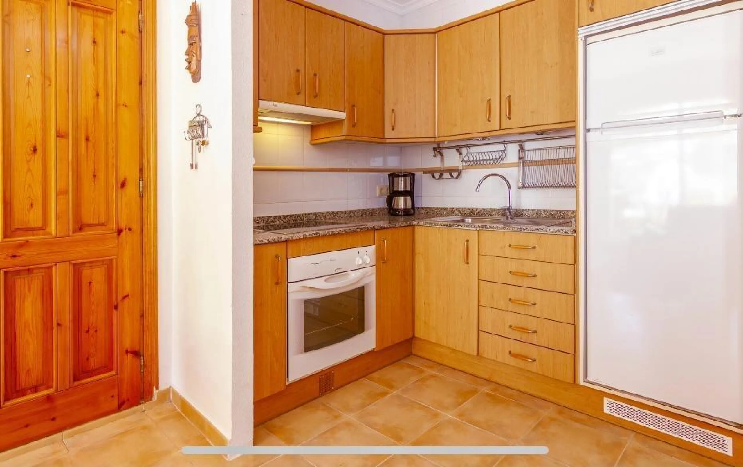 Apartamento en planta baja con jardín y gran piscina comunitaria en Cumbre del Sol