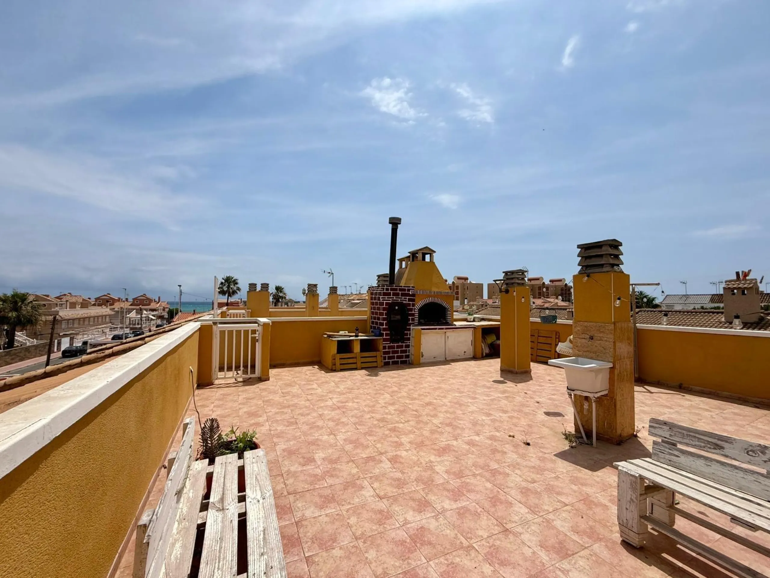 Spacious 4-bedroom apartment in La Mata with sea views, private solarium, and parking space