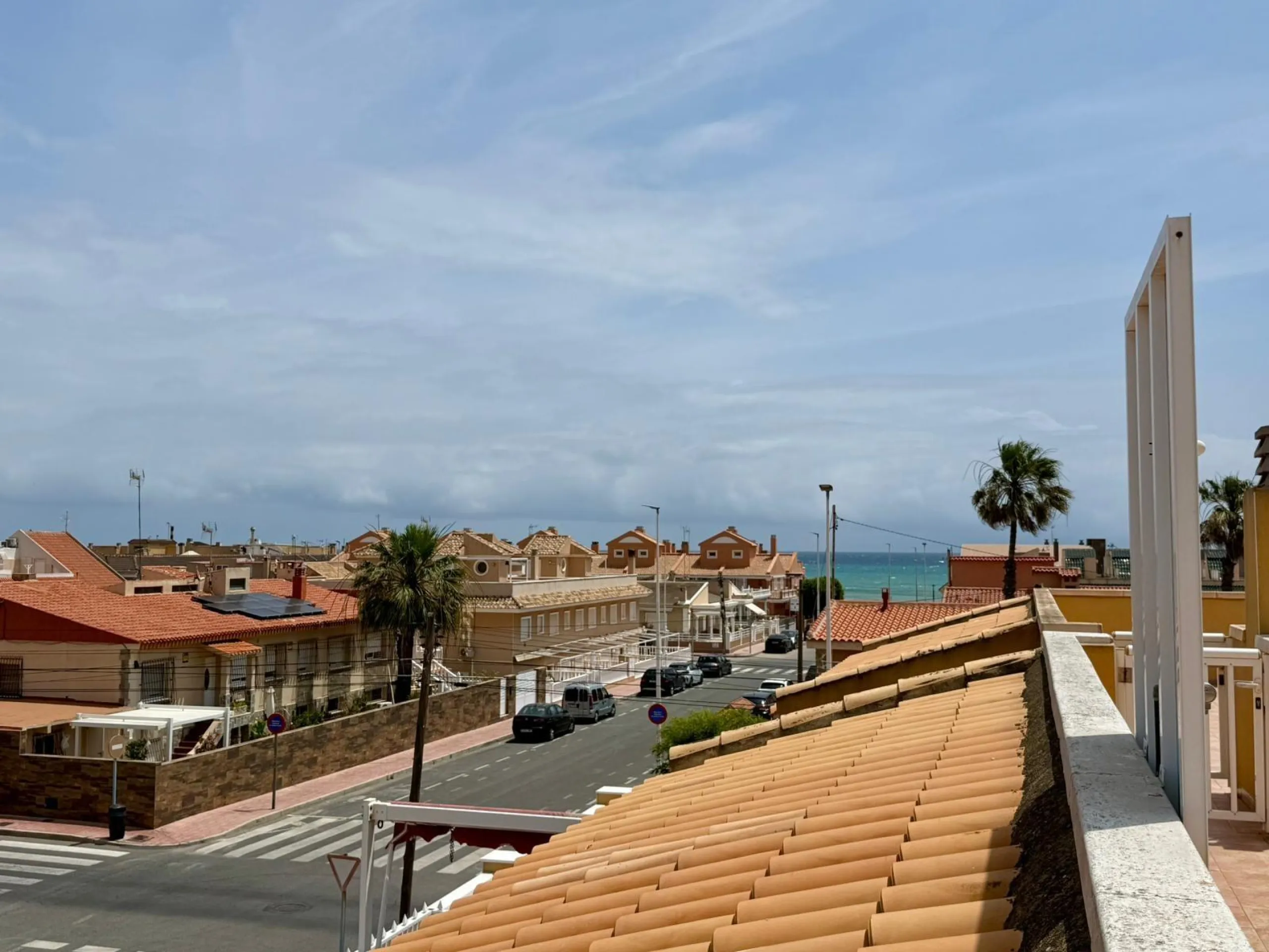 Spacious 4-bedroom apartment in La Mata with sea views, private solarium, and parking space