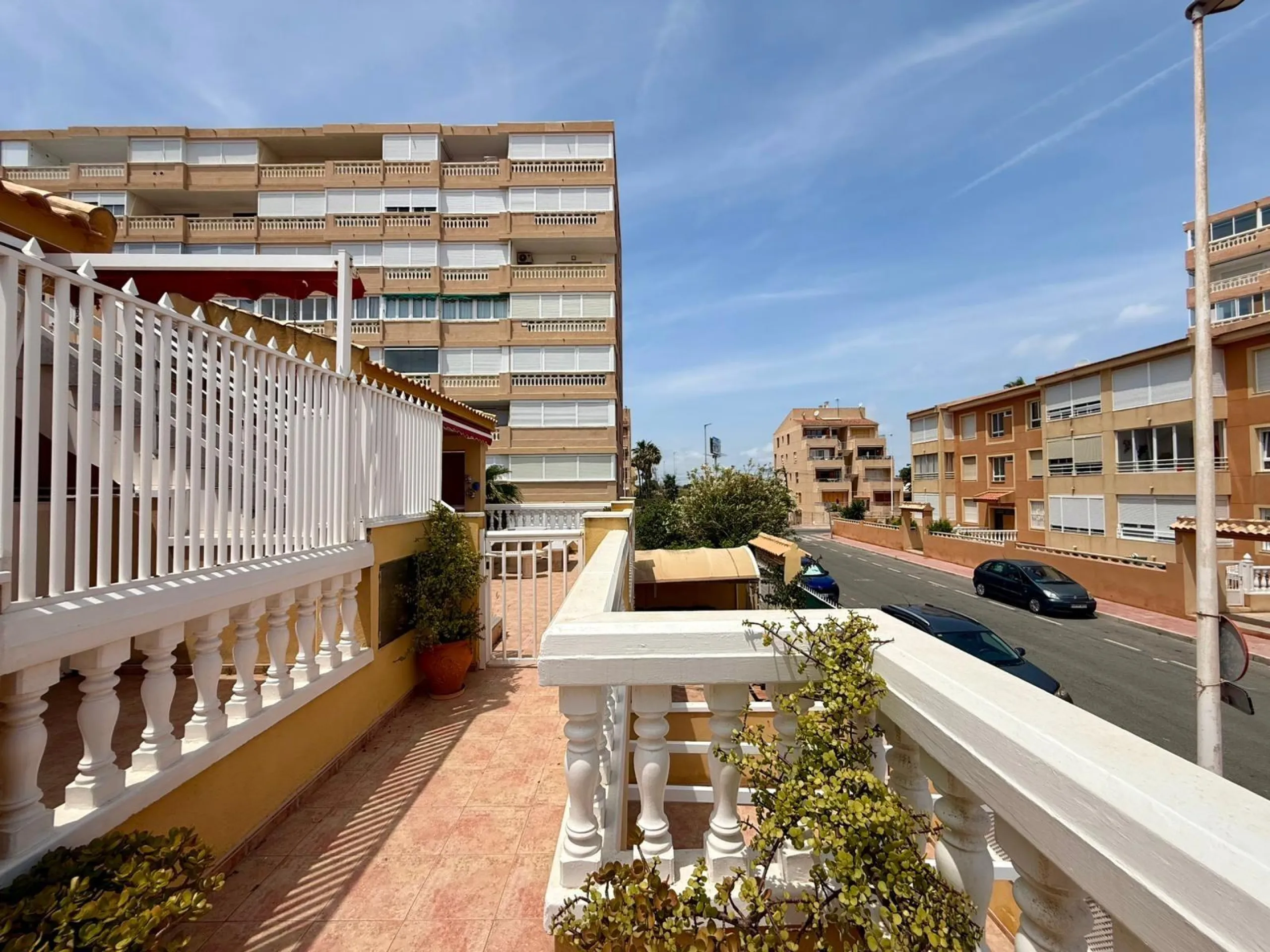Spacious 4-bedroom apartment in La Mata with sea views, private solarium, and parking space