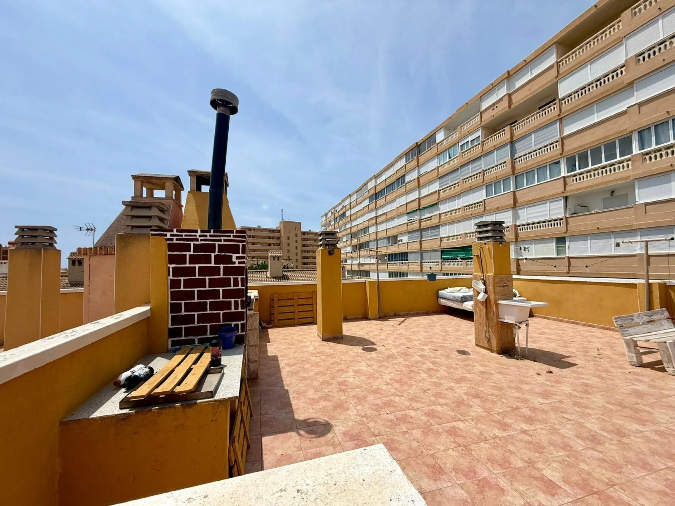 Spacious 4-bedroom apartment in La Mata with sea views, private solarium, and parking space