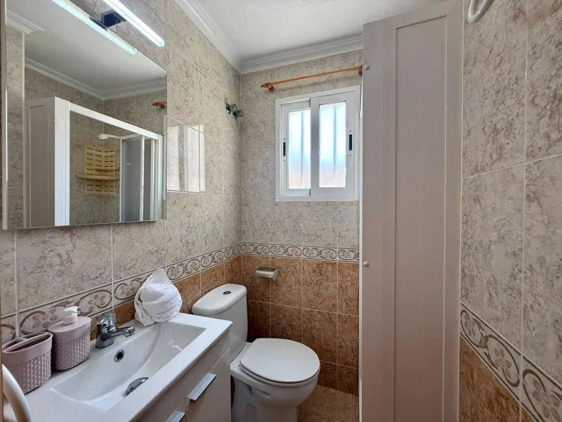 Spacious 4-bedroom apartment in La Mata with sea views, private solarium, and parking space