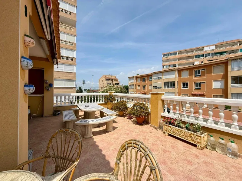 Spacious 4-bedroom apartment in La Mata with sea views, private solarium, and parking space