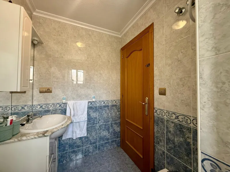 Spacious 4-bedroom apartment in La Mata with sea views, private solarium, and parking space