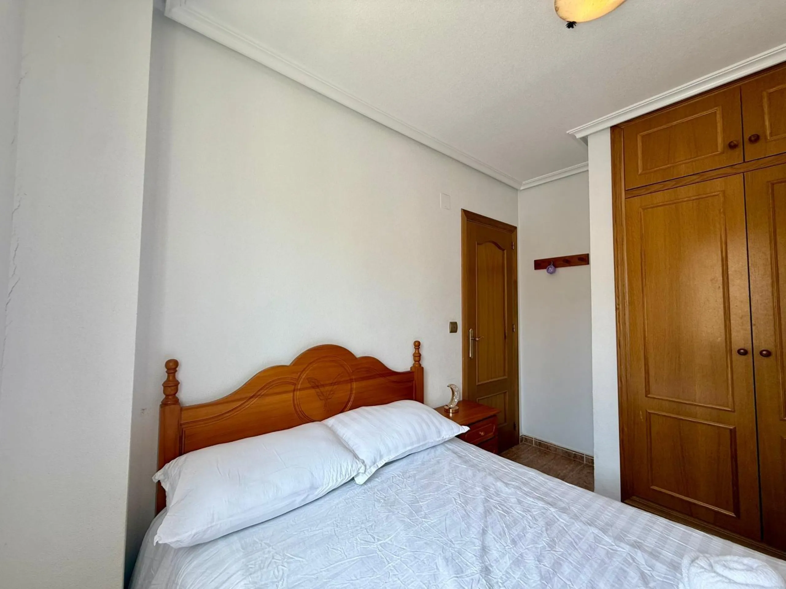 Spacious 4-bedroom apartment in La Mata with sea views, private solarium, and parking space