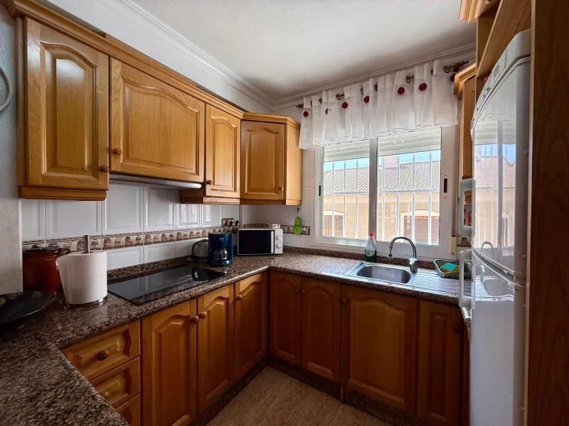 Spacious 4-bedroom apartment in La Mata with sea views, private solarium, and parking space