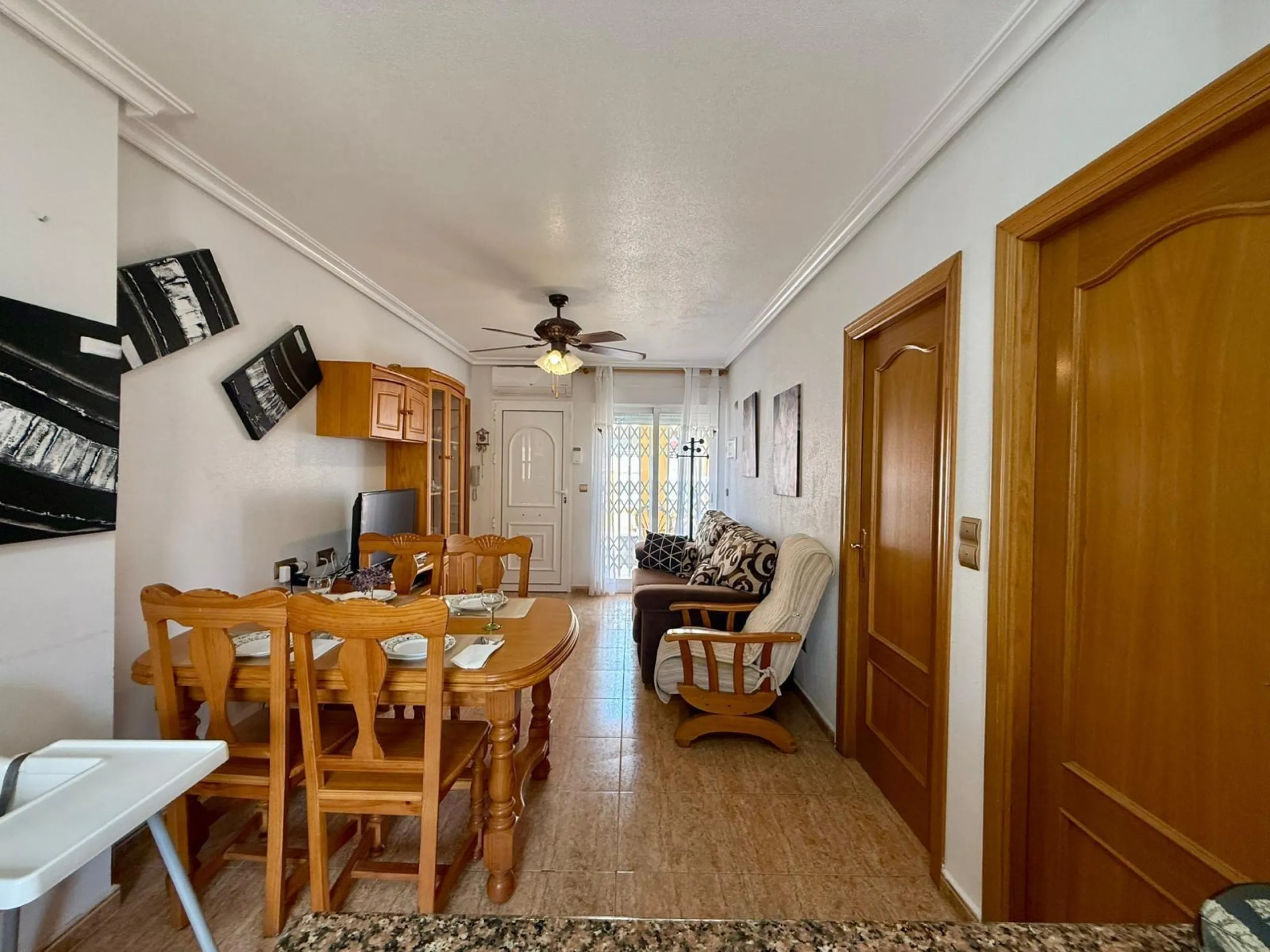 Spacious 4-bedroom apartment in La Mata with sea views, private solarium, and parking space