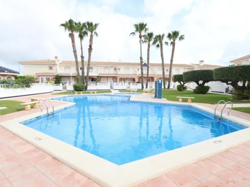 Ciudad Quesada, Residencial Elena – Corner townhouse directly facing the communal pool.