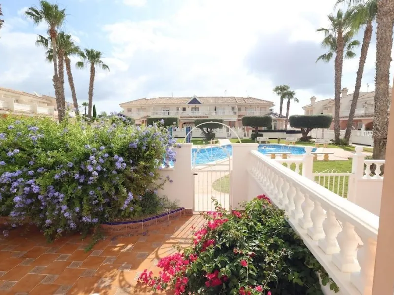 Ciudad Quesada, Residencial Elena – Corner townhouse directly facing the communal pool.
