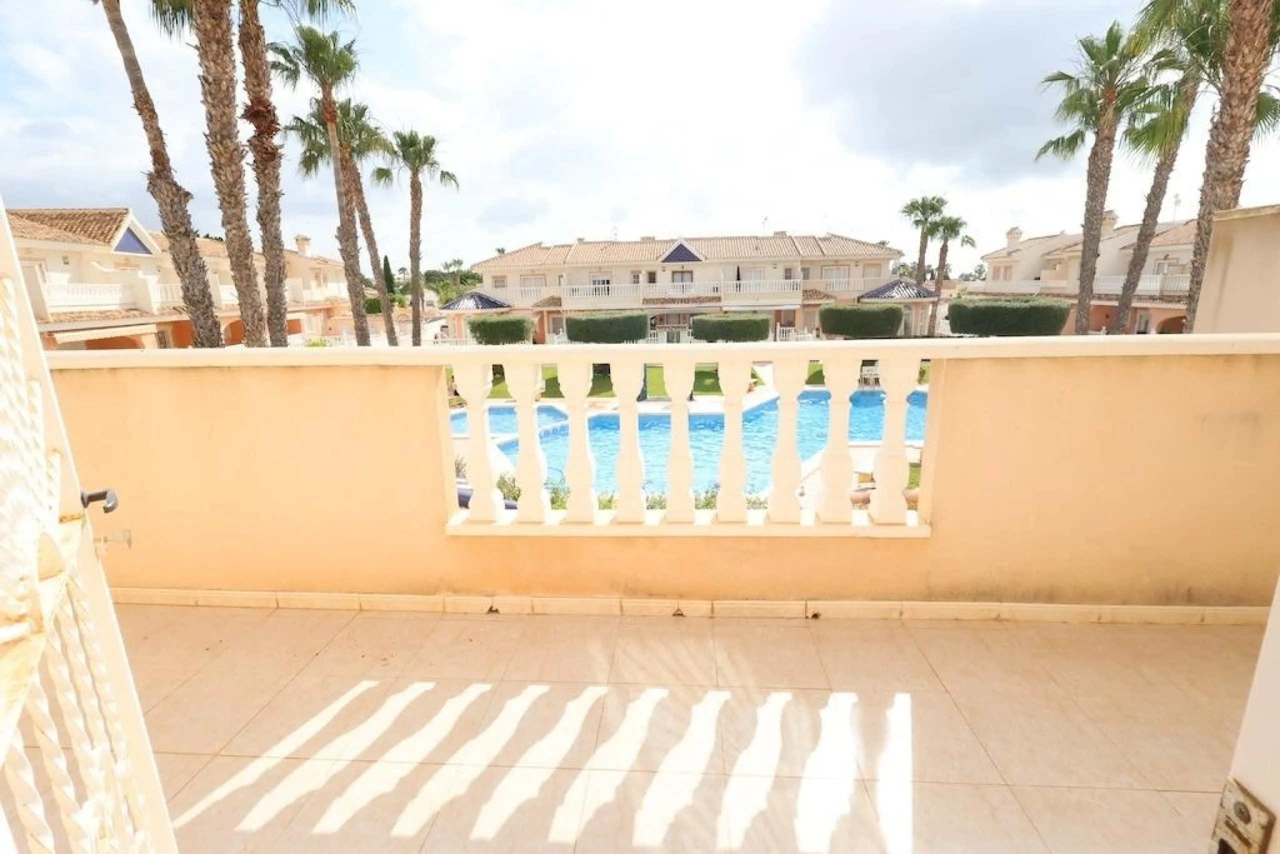 Ciudad Quesada, Residencial Elena – Corner townhouse directly facing the communal pool.