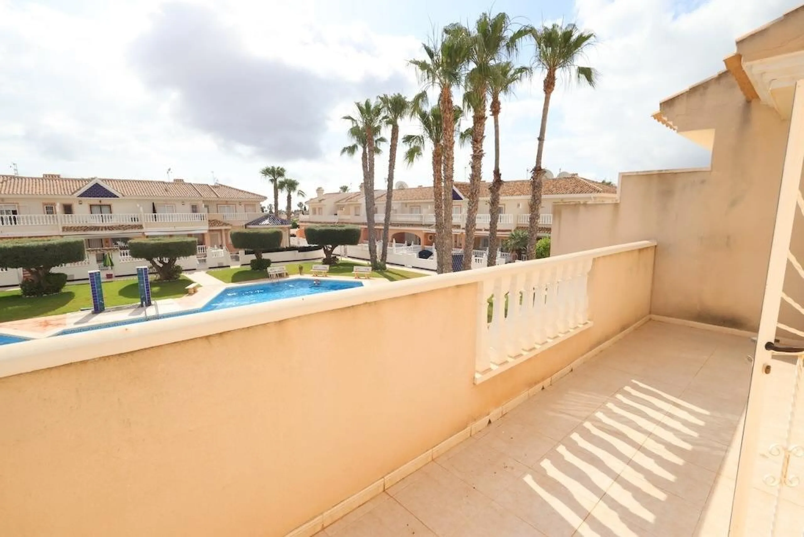 Ciudad Quesada, Residencial Elena – Corner townhouse directly facing the communal pool.