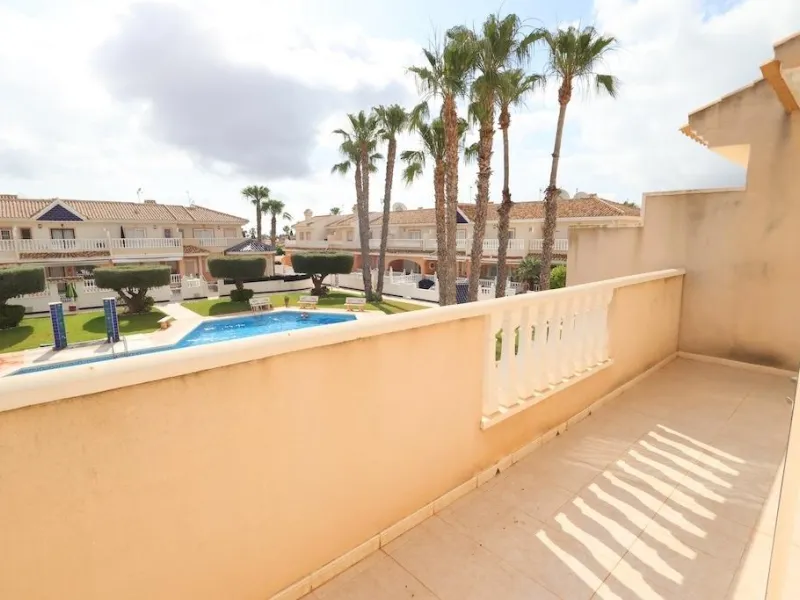 Ciudad Quesada, Residencial Elena – Corner townhouse directly facing the communal pool.