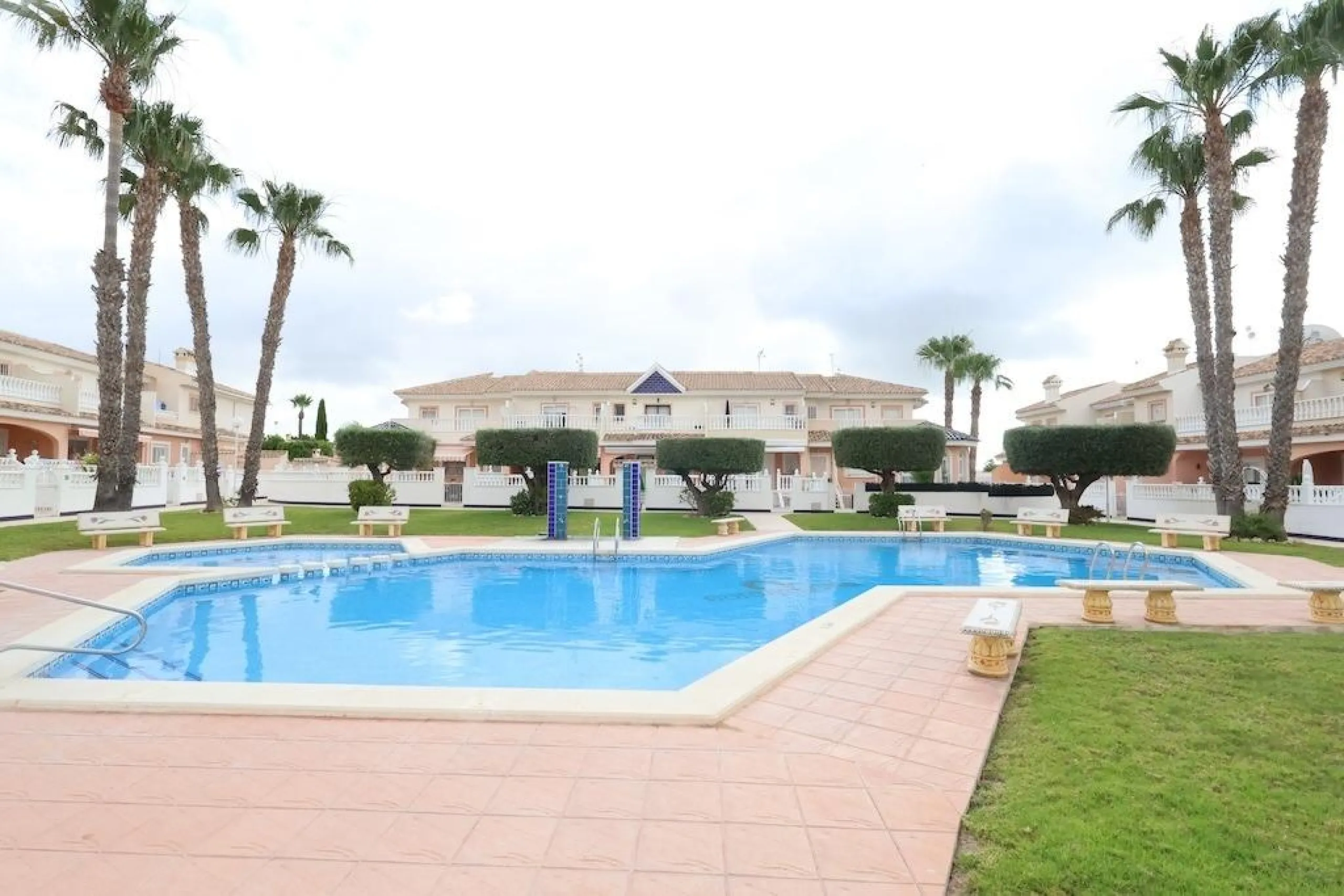 Ciudad Quesada, Residencial Elena – Corner townhouse directly facing the communal pool.