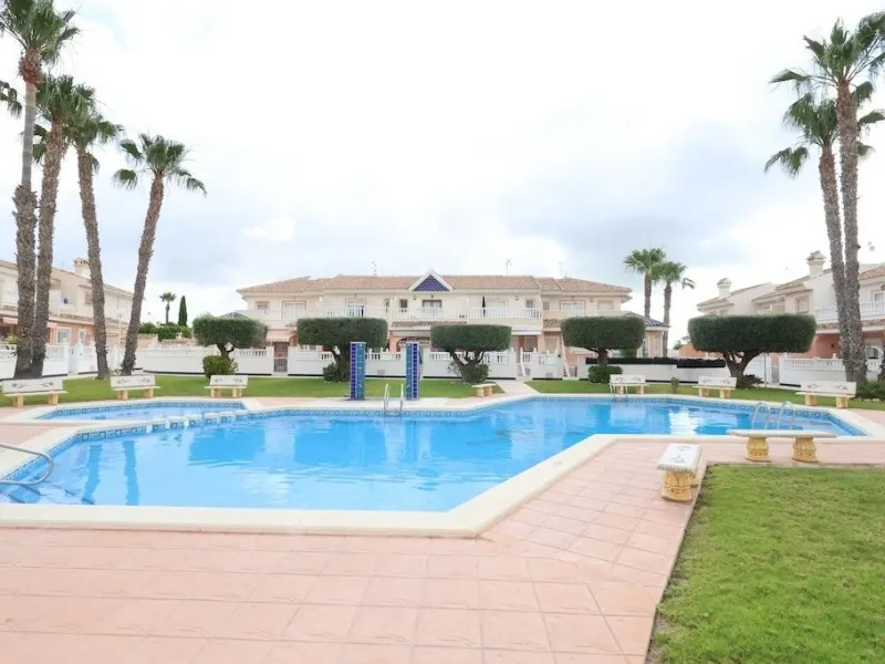 Ciudad Quesada, Residencial Elena – Corner townhouse directly facing the communal pool.