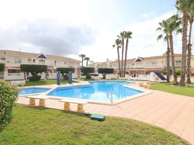 Ciudad Quesada, Residencial Elena – Corner townhouse directly facing the communal pool.