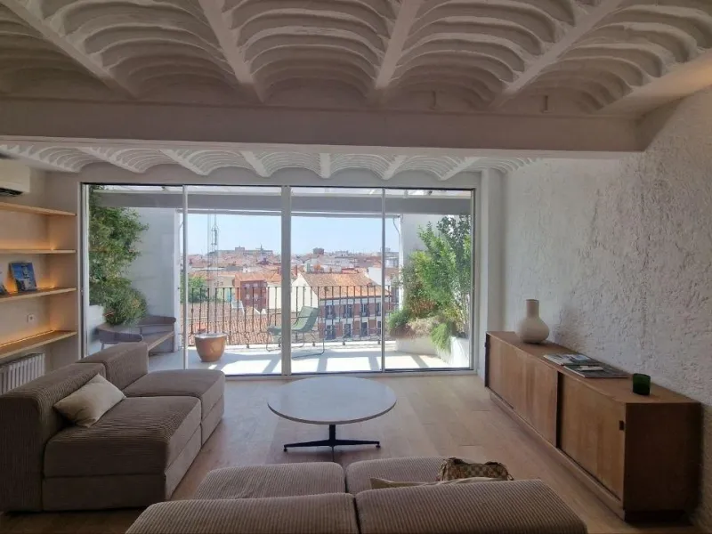 Penthouse with designer renovation and two terraces, in a historic building in the Palacio neighborhood.