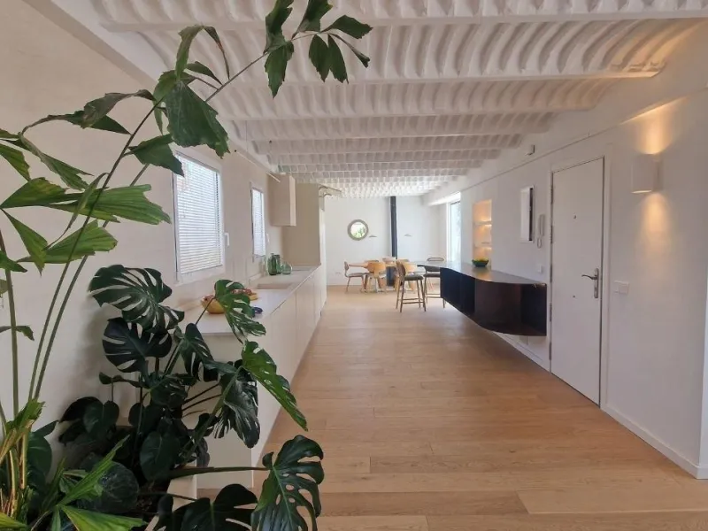 Penthouse with designer renovation and two terraces, in a historic building in the Palacio neighborhood.