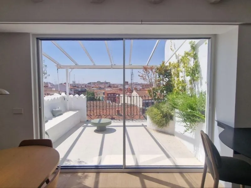 Penthouse with designer renovation and two terraces, in a historic building in the Palacio neighborhood.
