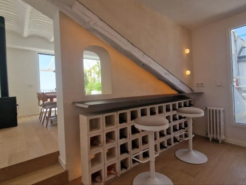 Penthouse with designer renovation and two terraces, in a historic building in the Palacio neighborhood.