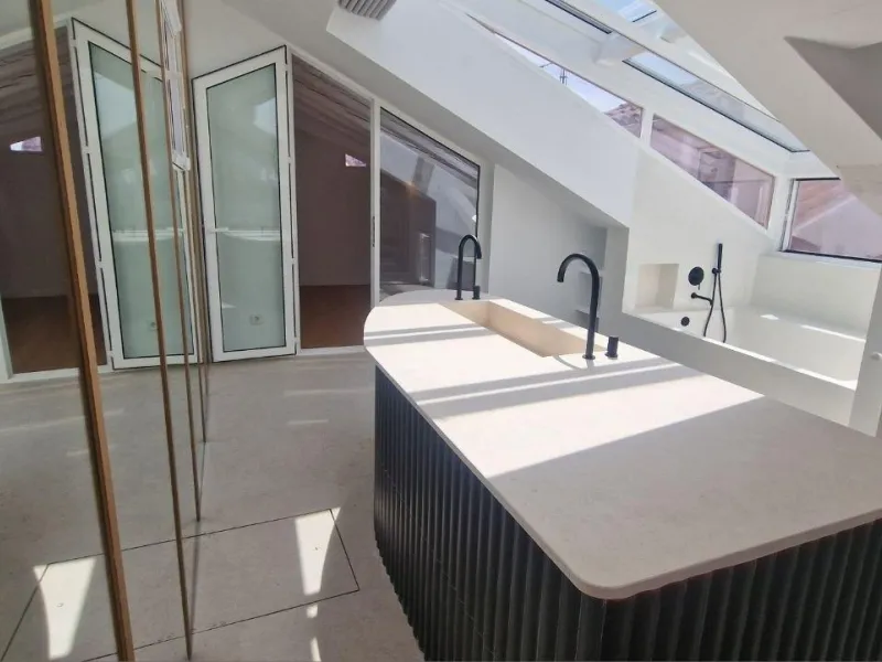 Penthouse with designer renovation and two terraces, in a historic building in the Palacio neighborhood.
