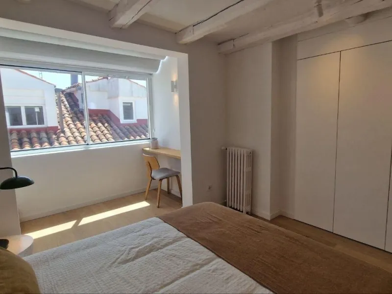 Penthouse with designer renovation and two terraces, in a historic building in the Palacio neighborhood.