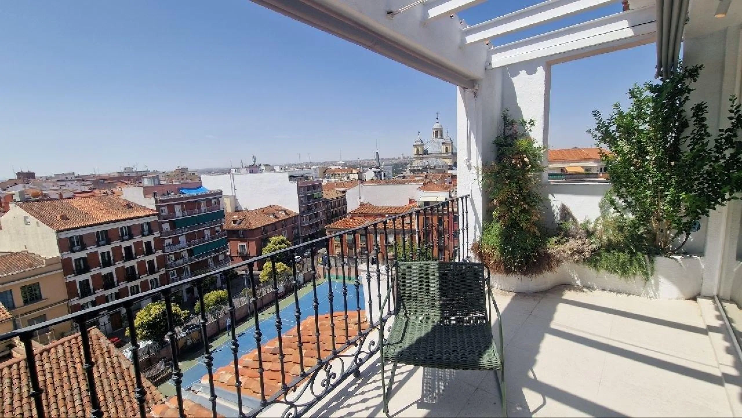 Penthouse with designer renovation and two terraces, in a historic building in the Palacio neighborhood.
