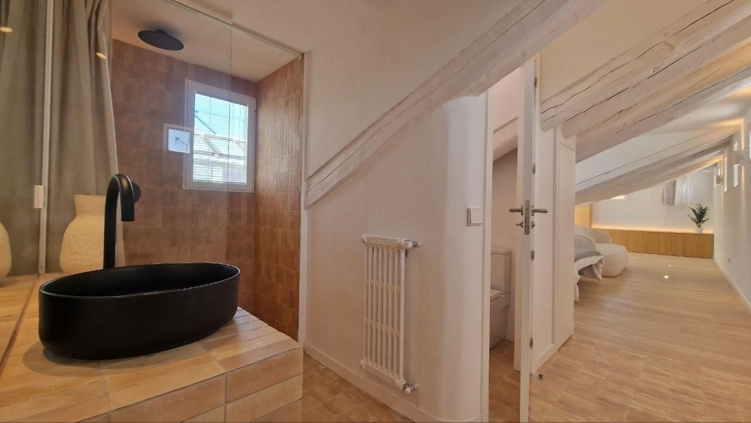 Penthouse with designer renovation and two terraces, in a historic building in the Palacio neighborhood.