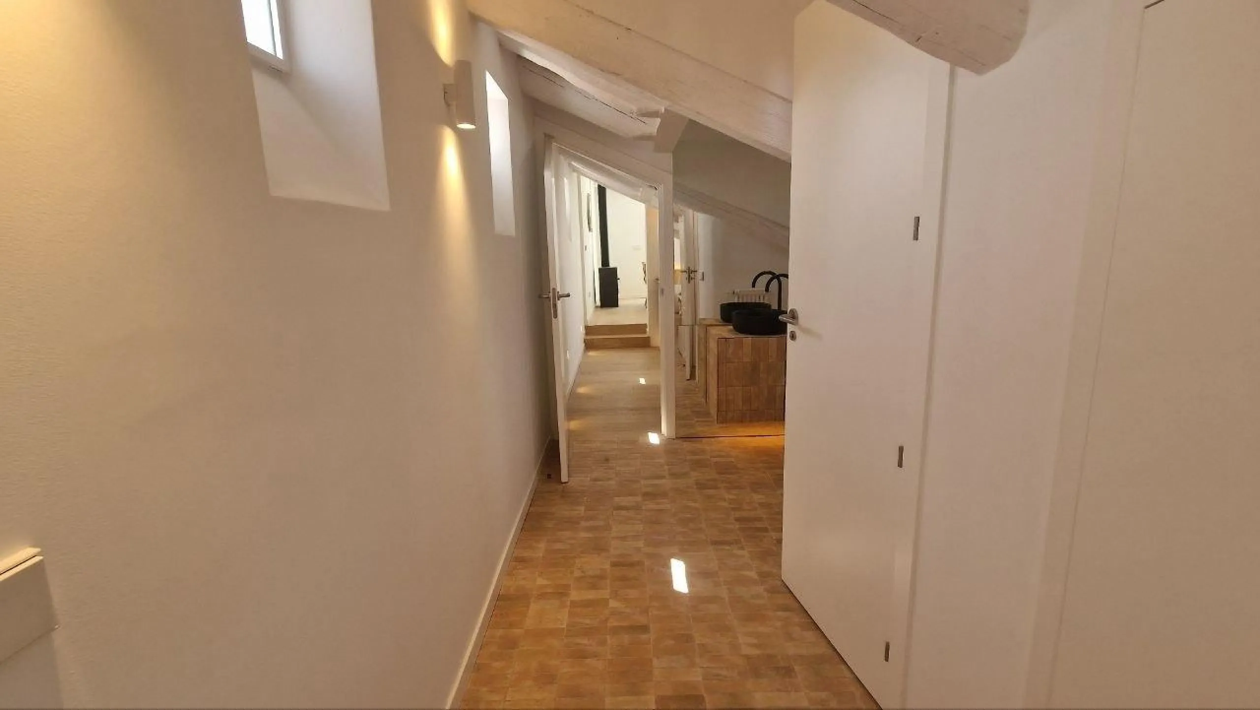 Penthouse with designer renovation and two terraces, in a historic building in the Palacio neighborhood.