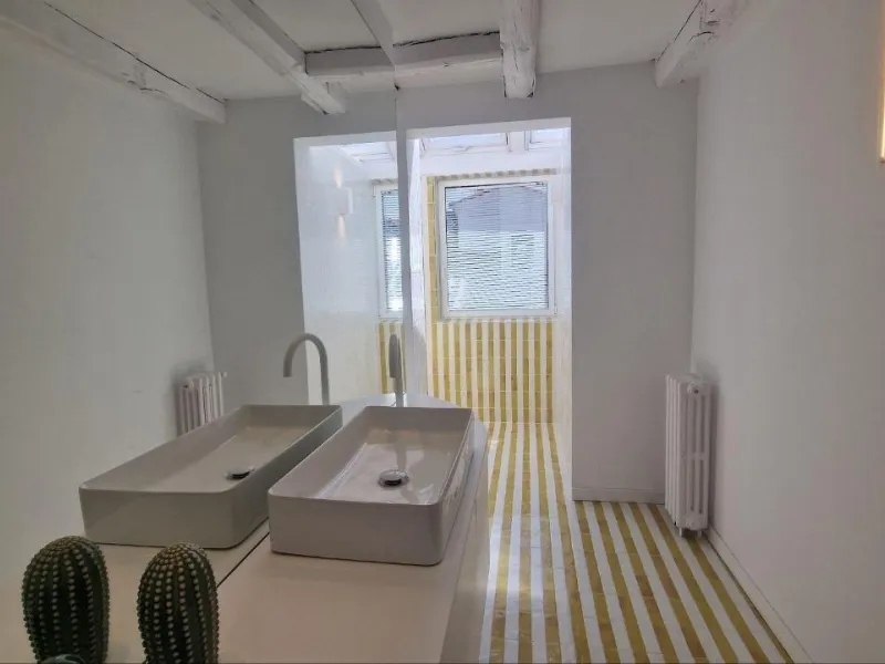 Penthouse with designer renovation and two terraces, in a historic building in the Palacio neighborhood.