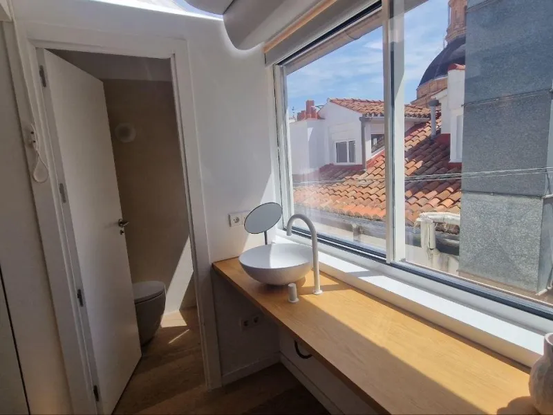 Penthouse with designer renovation and two terraces, in a historic building in the Palacio neighborhood.