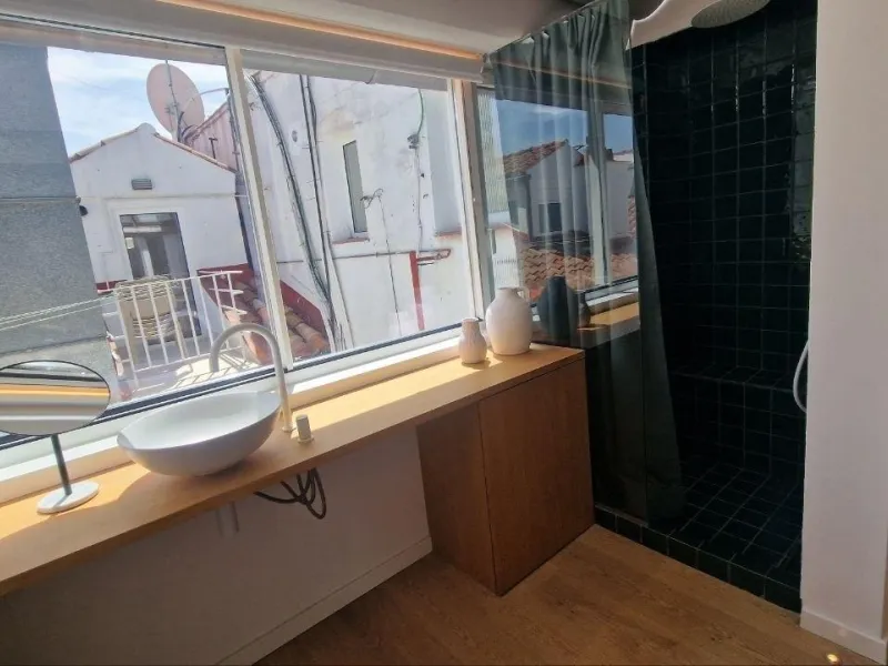 Penthouse with designer renovation and two terraces, in a historic building in the Palacio neighborhood.