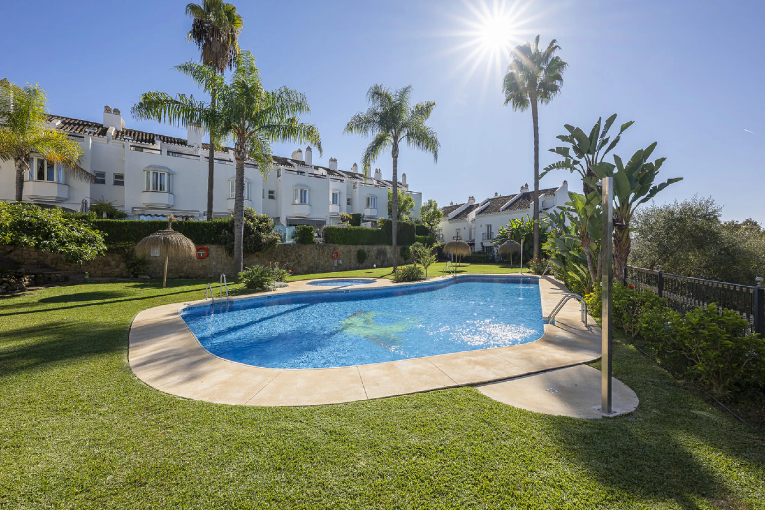 Situated in the sought-after urbanisation of Arco Iris in Altos de Puente Romano, this exceptional townhouse offers a rare opportunity to own one of the most spacious homes within the community. Set in the heart of Marbella's Golden Mile, just a short wal