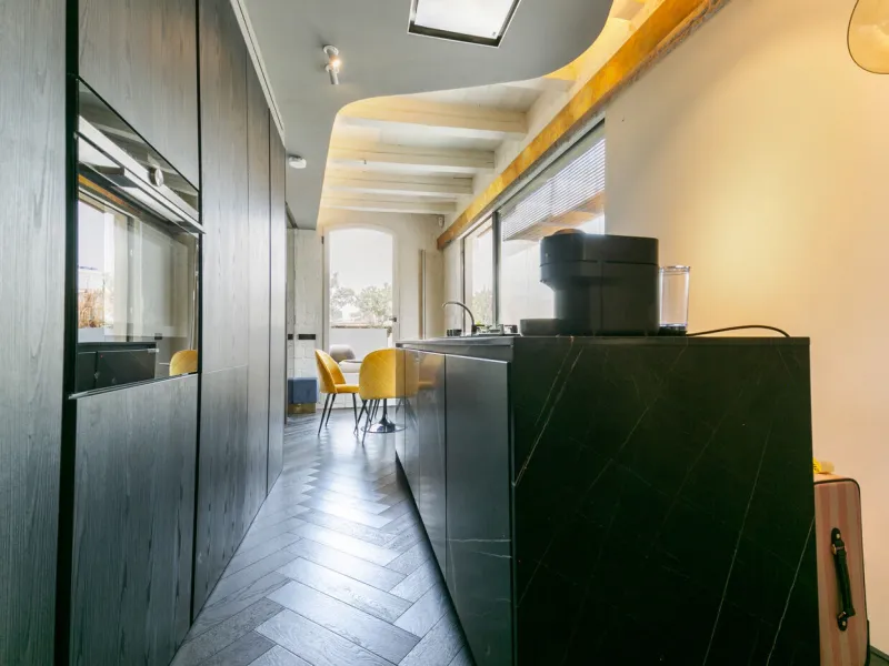 Piso ático con vistas panorámicas y amplia terraza privada en el centro de Barcelona