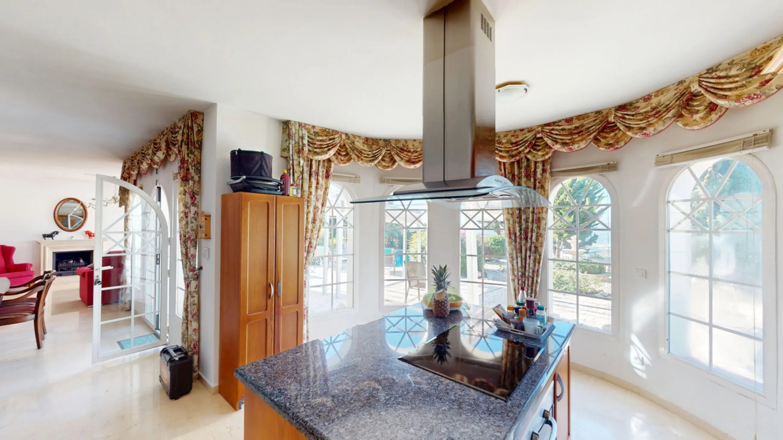 This elegant villa in Arenas, Málaga, offers a harmonious blend of space and style across two levels. The residence boasts four bedrooms and three bathrooms, with the primary bedroom providing generous personal space. The ground floor houses the main livi