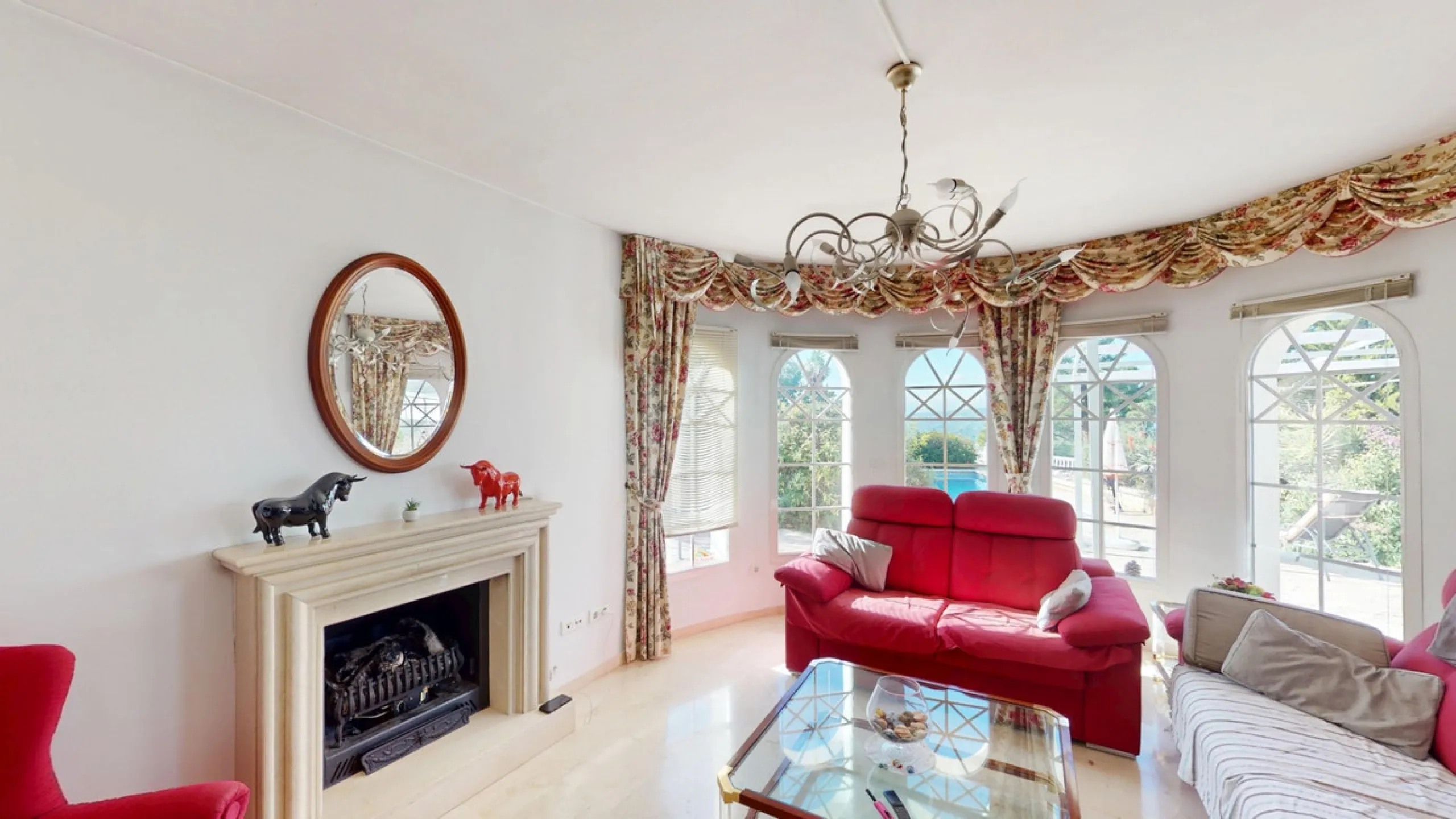 This elegant villa in Arenas, Málaga, offers a harmonious blend of space and style across two levels. The residence boasts four bedrooms and three bathrooms, with the primary bedroom providing generous personal space. The ground floor houses the main livi