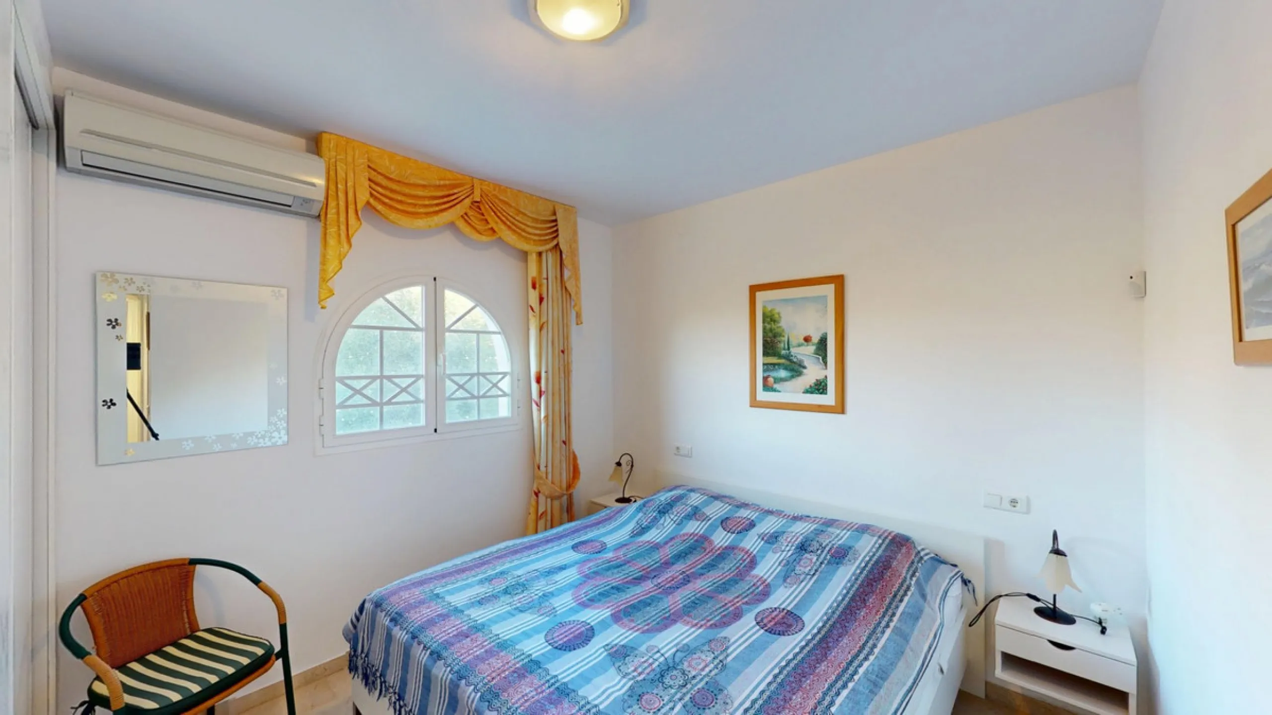 This elegant villa in Arenas, Málaga, offers a harmonious blend of space and style across two levels. The residence boasts four bedrooms and three bathrooms, with the primary bedroom providing generous personal space. The ground floor houses the main livi
