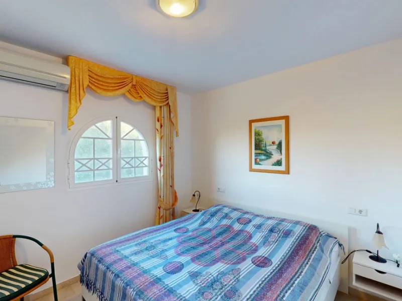 This elegant villa in Arenas, Málaga, offers a harmonious blend of space and style across two levels. The residence boasts four bedrooms and three bathrooms, with the primary bedroom providing generous personal space. The ground floor houses the main livi